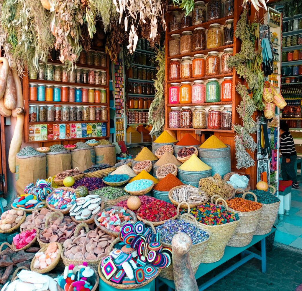 Vibrant Marrakech market filled with colorful spices and goods, showcasing the rich culture and lively atmosphere of Morocco