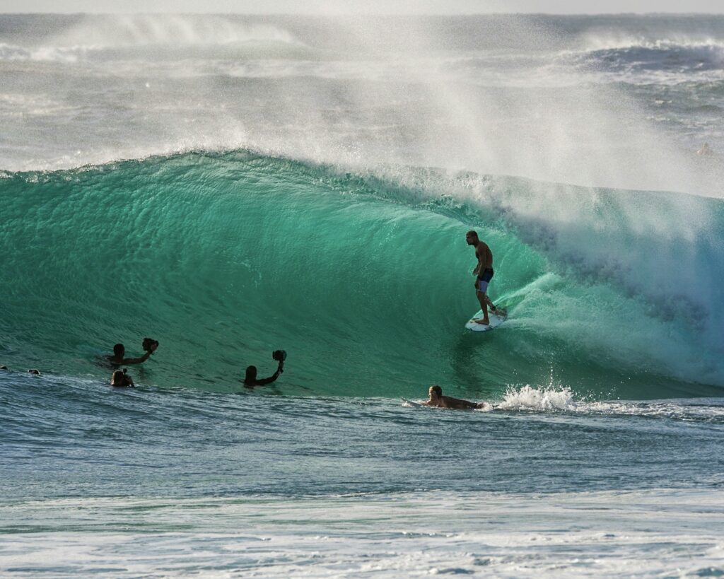 Mick Fanning in a barrel at Duranbah, Gold Coast, with surf photographers in the water capturing the thrilling moment, Australia Surf