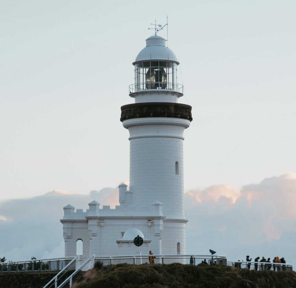 View of Cape Byron Lighthouse in Byron Bay against clear blue skies