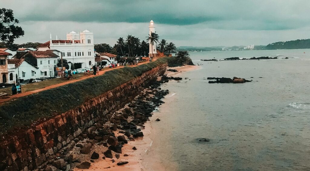 Galle Fort Sri Lanka with a long fence under dark clouds