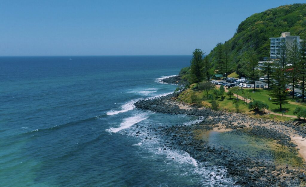 Burleigh Heads Surf Point with clear blue waters and clear skies