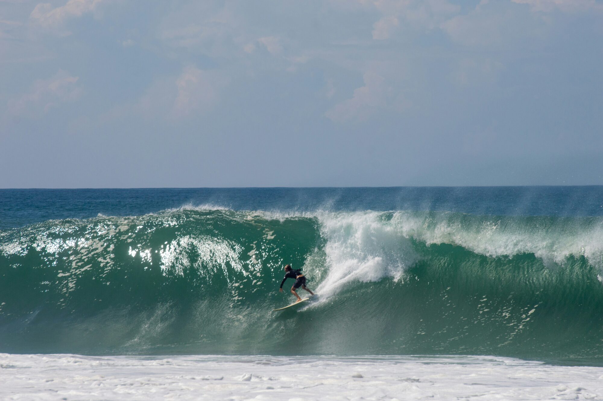 A surfer pulling into a perfect barreling wave at Playa Zicatela, Puerto Escondido surf, Mexico