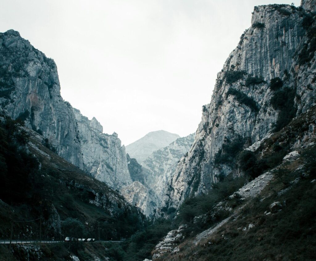 View from the base of Picos de Europa National Park, Spain, looking up at the mountains under clear blue skies