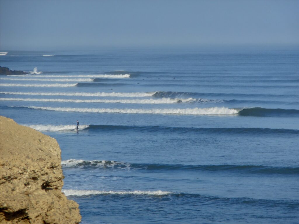 Long left lines at the famous chicama surf in Peru, clear water and blue skies