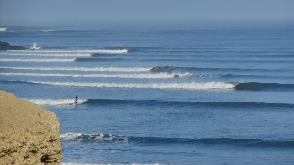 Long left lines at the famous chicama surf in Peru, clear water and blue skies