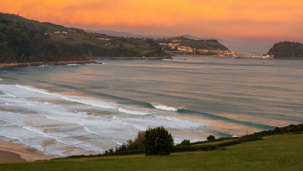 Yellow sunset and endless lines of surf at Zarautz surf
