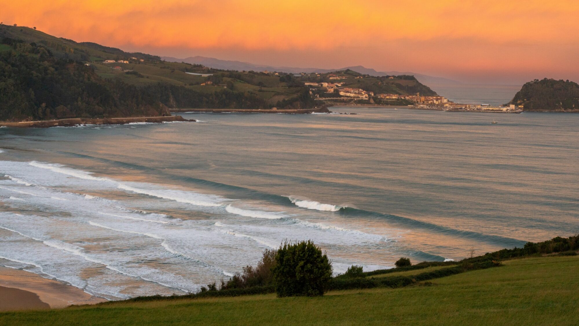 Yellow sunset and endless lines of surf at Zarautz surf