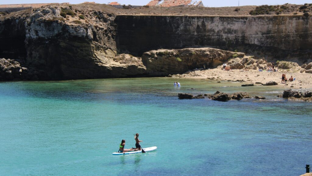 Two girls paddle boarding in Tarifa Spain