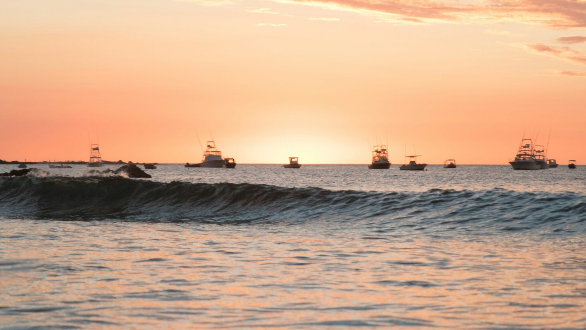 Tamarindo surf beach with an orange sunset in Costa Rica