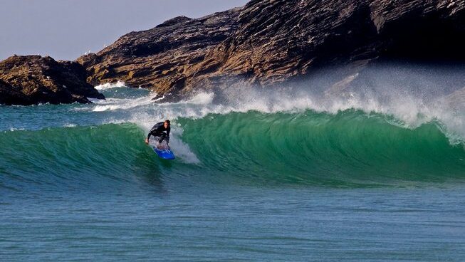 A surfer learning how to stand at Newquay Surf with Base Surf Lodge surf camp