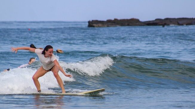 A surfer learning how to surf in Montanita surf with Casa del Sol Montanita surf camp