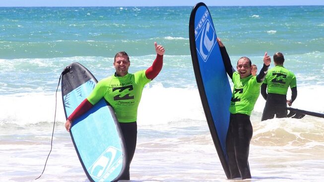 Two surfers enjoying the surf with Jeffreys Bay Surf Camp