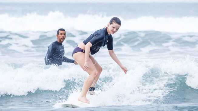 A student at Vikara Healing Center in Olon surf camp how to surf