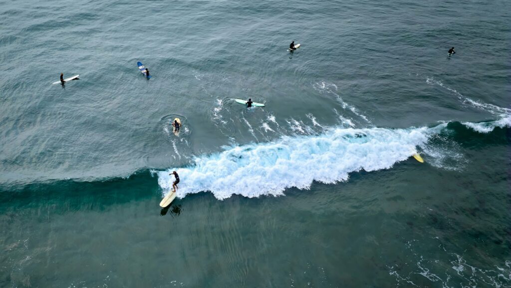 Perranporth surf with lots of surfers with Malibus