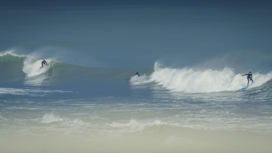 Two surfers in Narragansett surf in Rhode Island