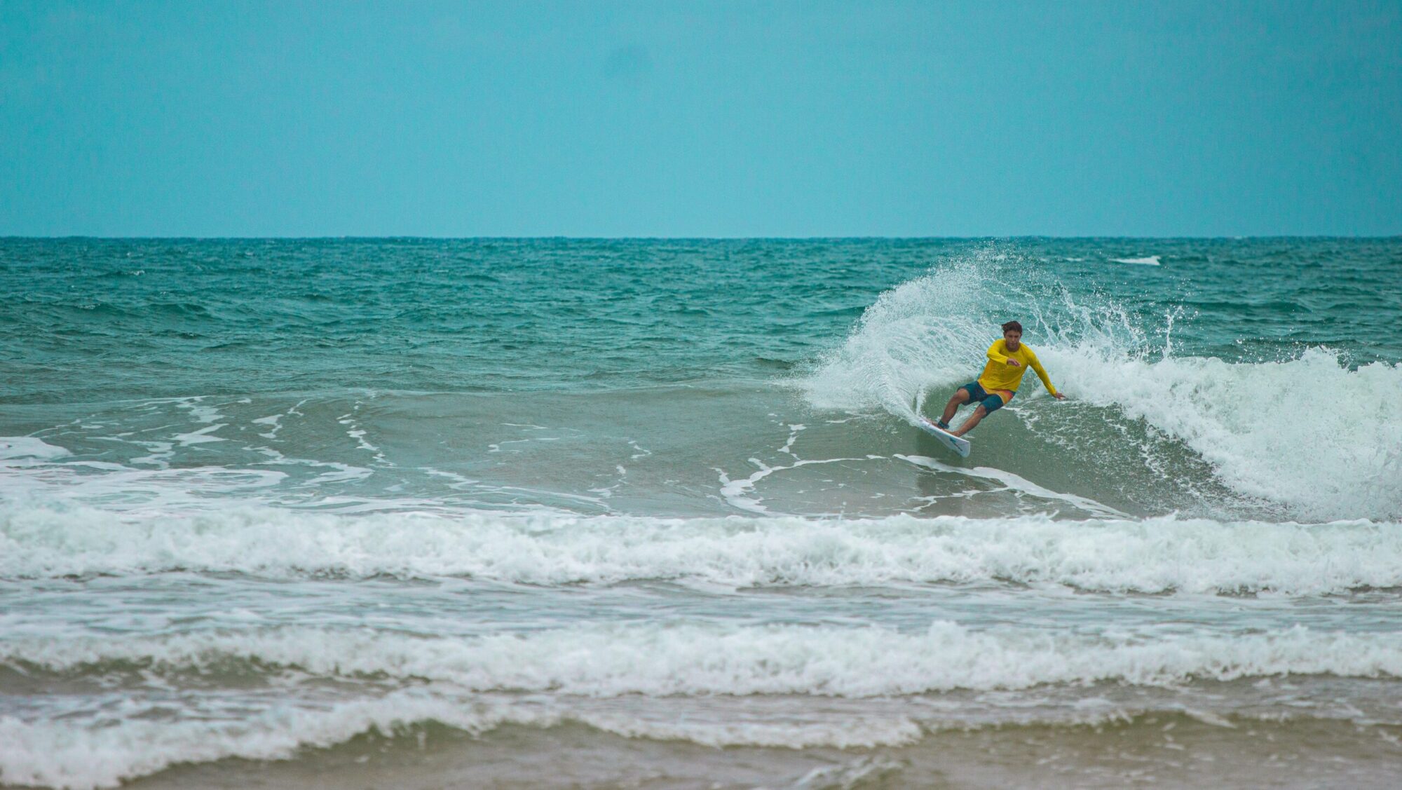 A surfer pulling a cutback in Mompiche surf Ecuador