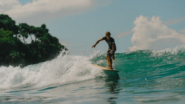 A surfer almost hanging ten in Hiriketiya surf Sri Lanka