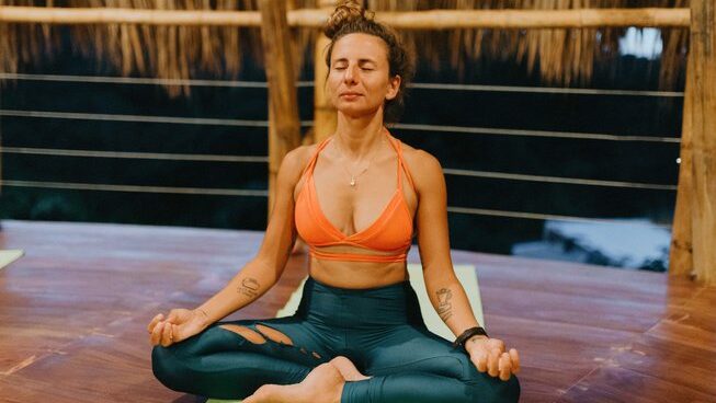 A person doing yoga at Dreamsea Surf House surf camp Tamarindo Costa Rica