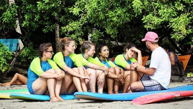 Surfers learning at La Botella de Leche surf camp in Tamarindo Costa Rica