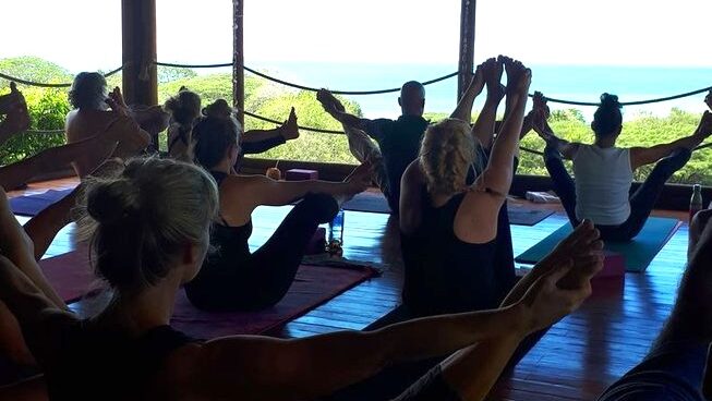 People doing yoga at Pura Vida Surfers Surf and Yoga Retreat in Santa Teresa