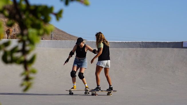 Two girls skating at Salty Chicas surf camp