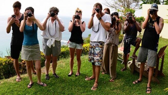 Photographers all taking a photo at accommodation at Jaco surf camp with school of the world