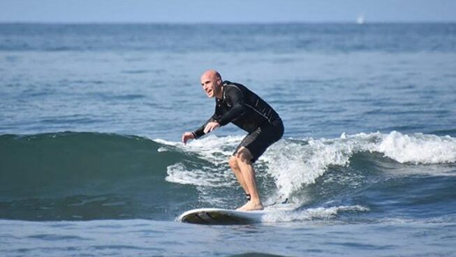 A surfer learning how to surf at Surf Inn Hermosa surf camp