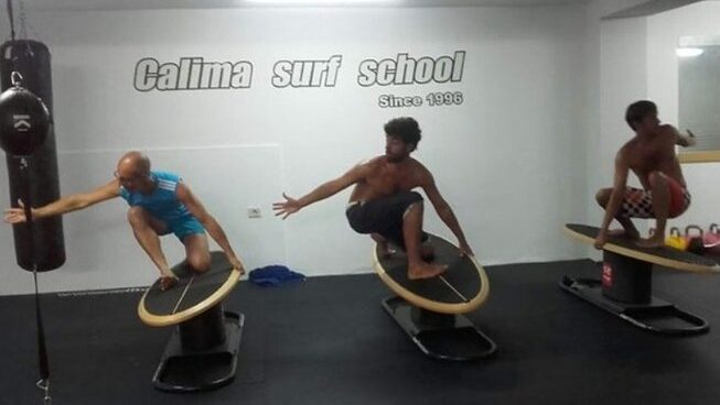 people practicing surfing on fake boards with beginner surf camp Canary Islands