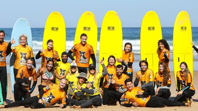 Group photo of learner surfers at Portugal Surf Camp Algarve Beginner