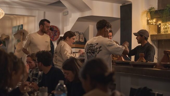People getting their food or eating food at The Surf Hotel Morocco