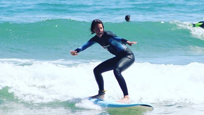 a learner surfer on a wave at Alex Surf School surf camp in Peniche