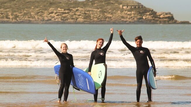 3 people learning how to surf with Atlanticzin Watersports surf camp in Essaouira Morocco