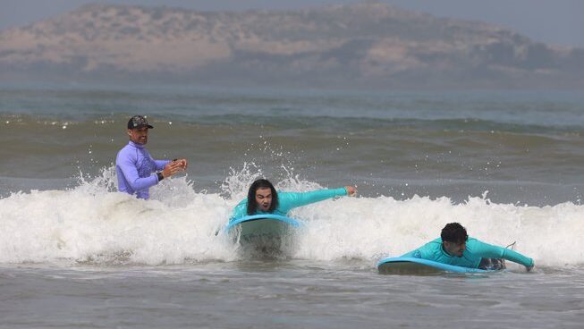 Two surfers learning how to surf with Bleuryde Watersports surf camp in Essaouira Morocco