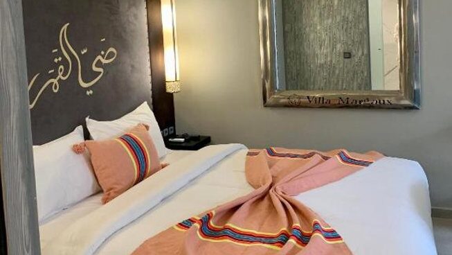 Accommodation of bed with mirror at Bleuryde Watersports surf camp in Essaouira Morocco