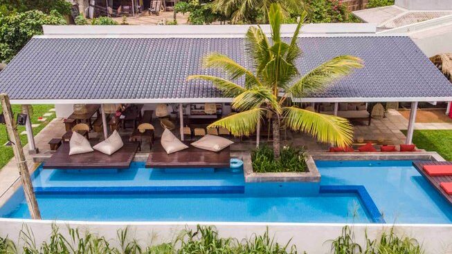 Drone view of the accommodation and pool at Global Surf Lodge Kabalana in Sri Lanka