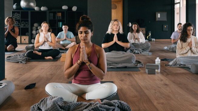 people in a yoga pose at Golden Waves Surf and Yoga Lodge surf camp Portugal