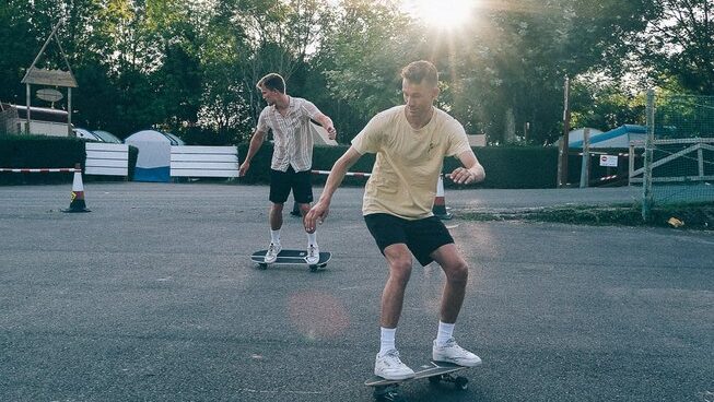 Two people learning how to skate at Good People Surf surf camp in Zarautz