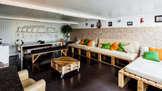Hang out area with couches at Hostel & Surfcamp 55 in Ericeira