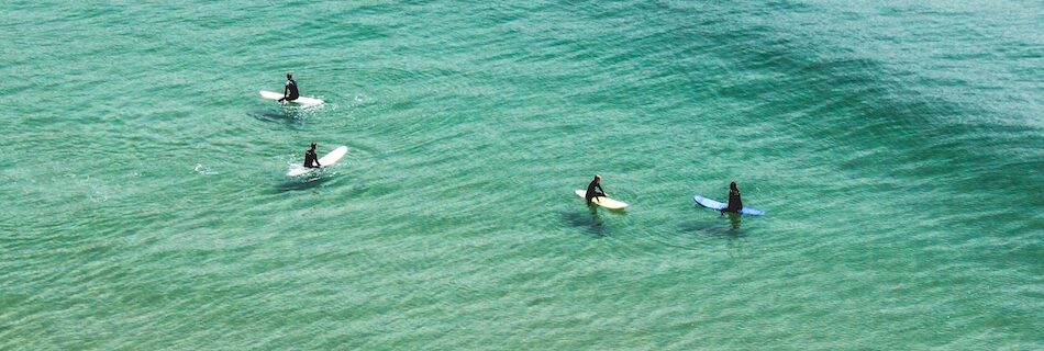 Imsouane surf camp Morocco with surfers in crystal blue water