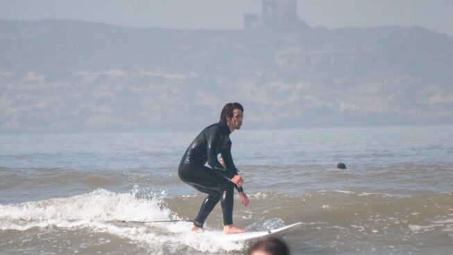 A guy surfing at Loving Surf Essaouira Surf Camp Morocco