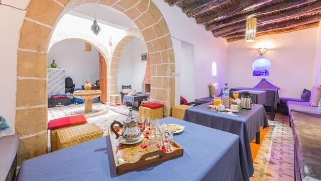 Accommodation with dining room table at Naneakite Surf Camp in Essaouira Morocco