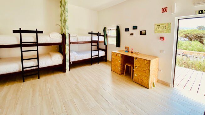 hostel style accommodation with bunk beds at Portugal Praia das Maçãs Surf Camp in Sintra