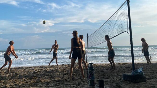 people playing volleyball at Pura Vida Surfers surf camp in Santa Teresa
