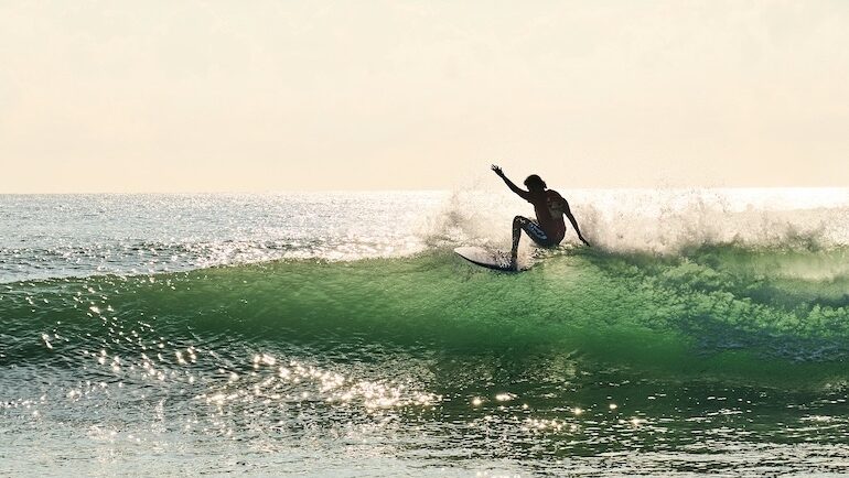 a surfer doing a turn at a Santa Teresa Costa Rica surf camp