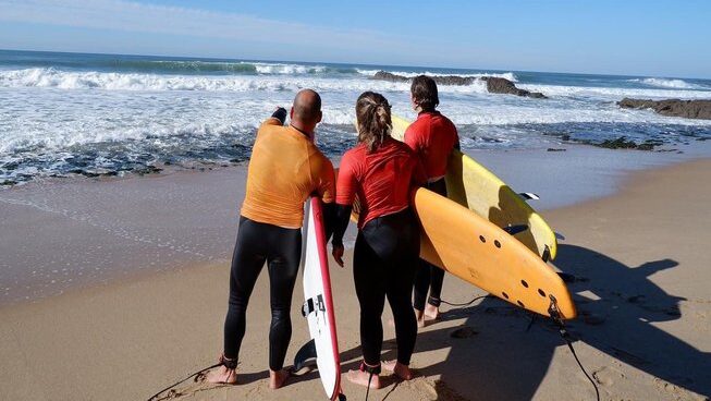 learner surfers and instructor at Sea Krew surf camp