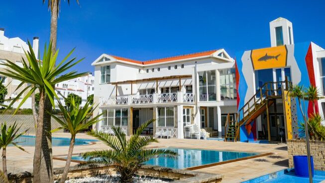 accommodation and pool at Shark’s Lodge surf camp in Peniche Portugal