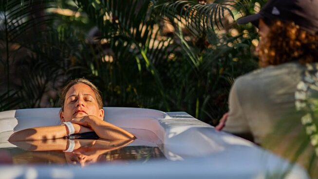 a person in an ice bath at Surf Camp Zeneidas surf camp in Santa Teresa