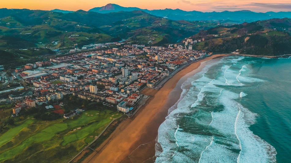 A drone shot of Surf camp Zarautz Spain at sunset