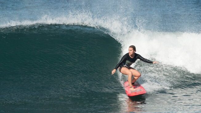 a surfer on a clean wave at Surfari Surf School surf camp in Nosara, Costa Rica