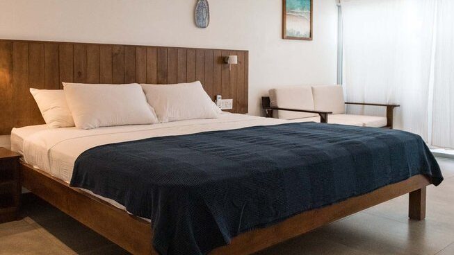 Accommodation and queen bed at Surfari Surf School in Nosara Costa Rica